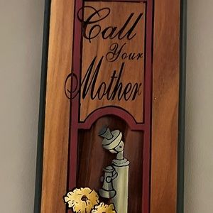 “Call Your Mother She Worries” carved wooden wall plaque.  11” tall